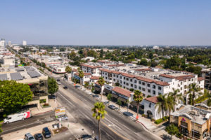 Aerial view of urban street and buildings.